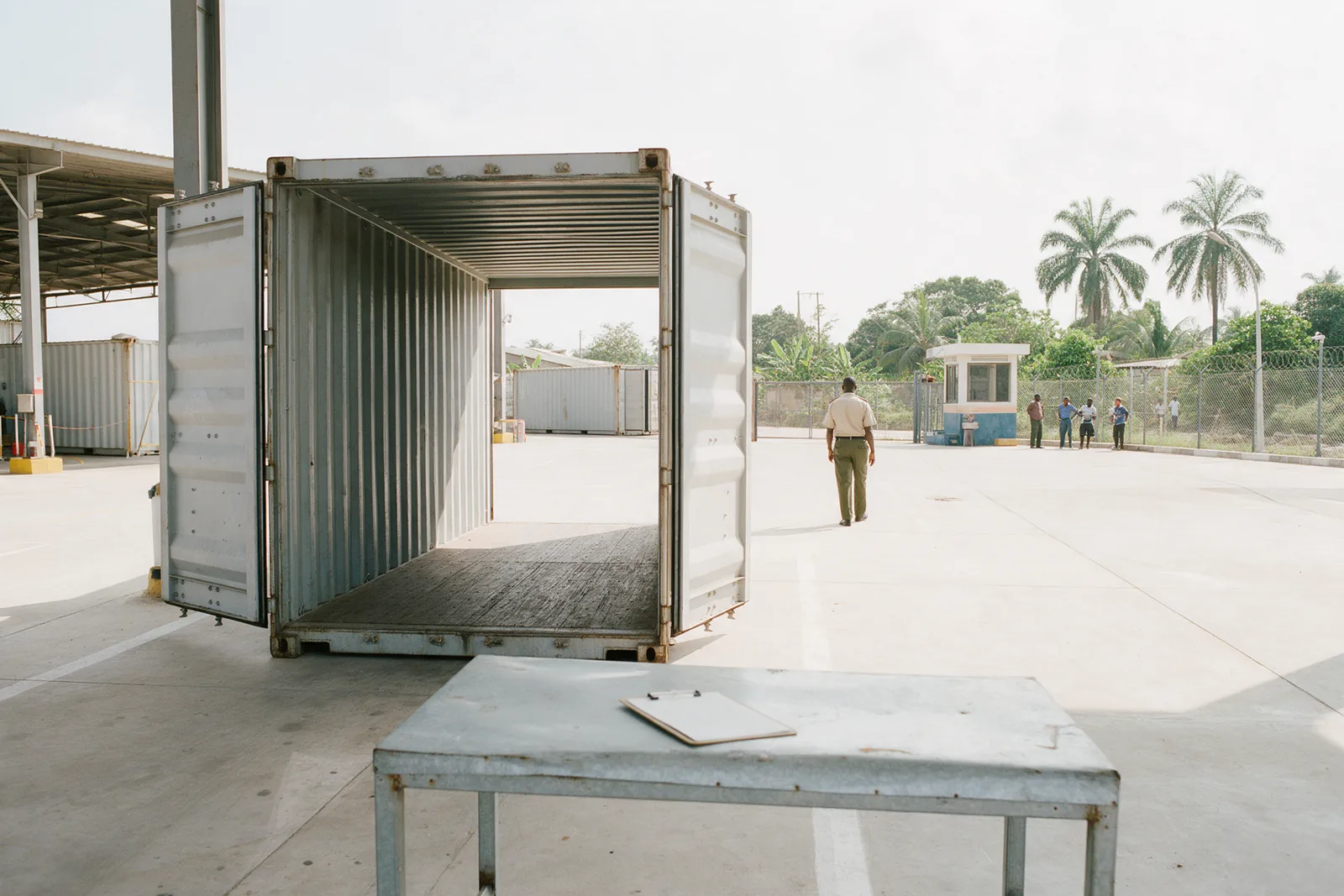 A container standing open at a customs inspection bay.